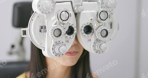 Preview: Young Woman checking on eye in clinic