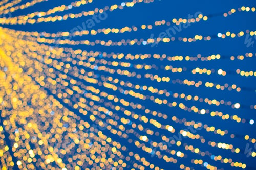 Preview: Yellow and blue abstract background of bokeh defocused blurred lights garland