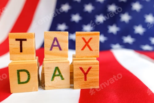 Preview: Tax day written with wooden letters to indicate the day of payment of taxes in america.
