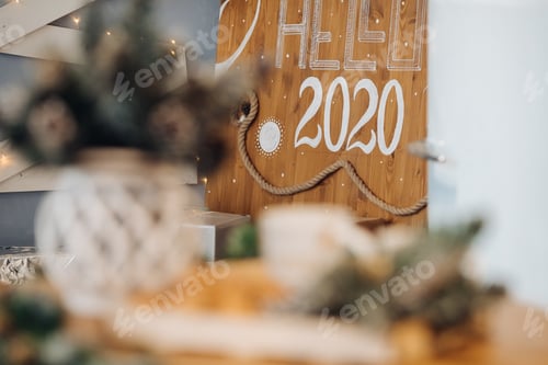 Preview: Beautiful white letters Happy New Year at blue wall in modern decoration studio