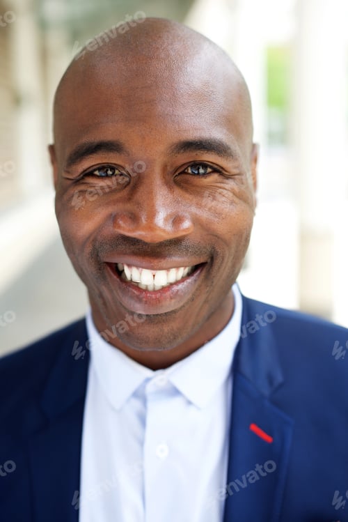 Preview: Smiling older african american businessman
