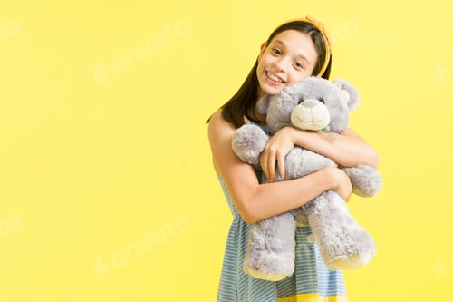 Preview: Adorable young girl playing with her toys