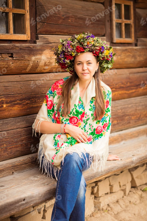 Preview: Young pretty ukrainian woman with a wreath of dry herbs on her head