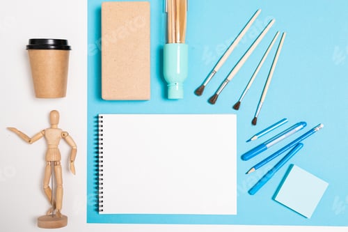 Preview: design concept. a blank notebook with drawing accessories on the table