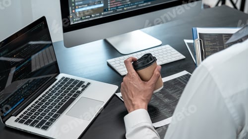 Preview: Professional programmer working on website project in software development on the desktop computer