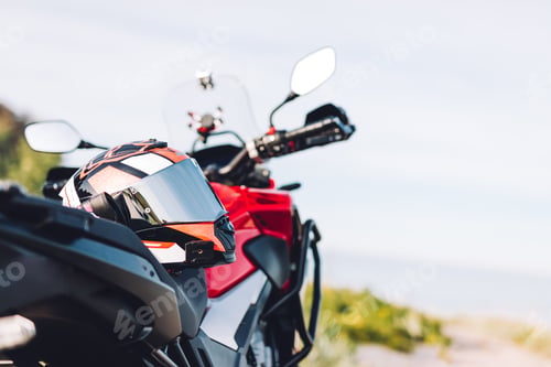 Preview: Adventure motorbike on grassy roadside. Offroad trip
