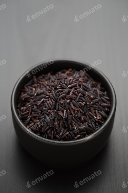 Bowl of Black Rice on Dark Background