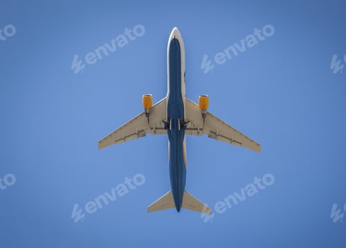 Preview: The plane flies in the blue sky. Travel and flight. Aircraft airplane