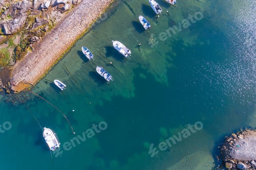 Preview: zenithal aerial drone view of a small fishing boat harbor in Portugal