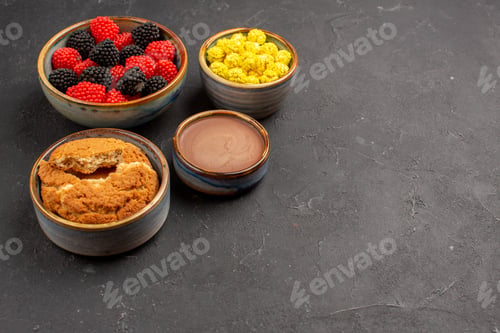 Preview: front view sweet candies with cookies on dark background candy color confiture tea