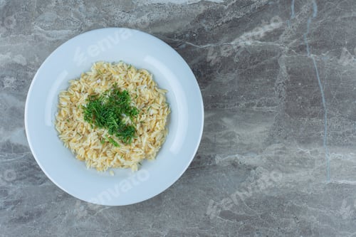 Preview: Cooked basmati rice in a plate , on the marble background