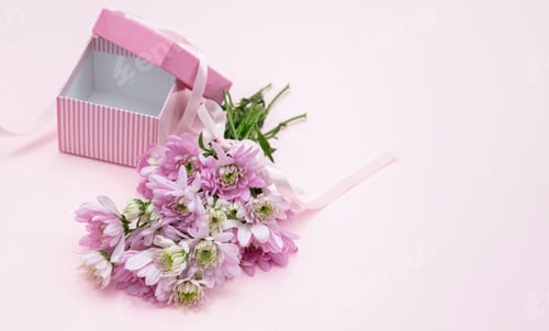 Preview: Fresh flower bouquet and gift box on pink, closeup. Women, mothers day