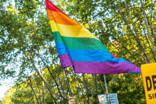 Preview: Madrid, Spain: July 9, 2022: Flag at the party and parade of gay pride, lgbt in Madrid