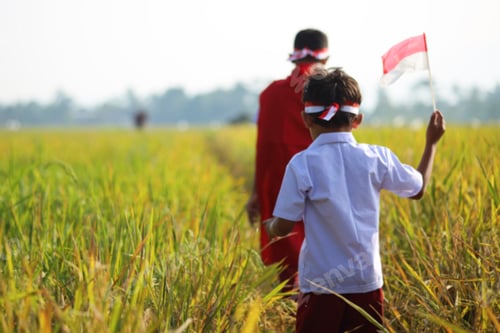 Preview: Blurry Indonesian Kids Holding Flag