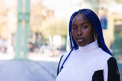 Preview: Thoughtful black woman on street