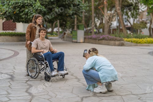 Preview: Woman and handicapped man posing while a friend taking photo