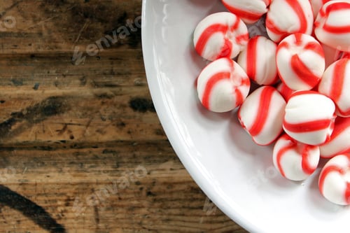 Preview: Peppermint candies in plate with copy space