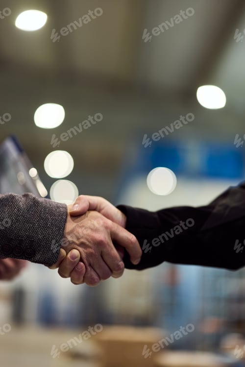 Preview: Close-Up Handshake Symbolizing Collaboration and Business Agreement in Office Setting