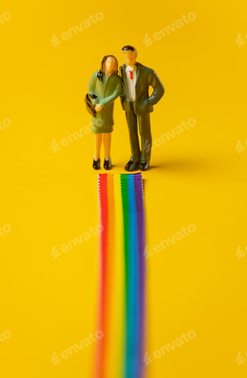 Preview: Woman and man stands face on rainbow path