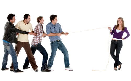 Preview: Beautiful Woman Pulling A Rope Against A Male Team - Isolated On White