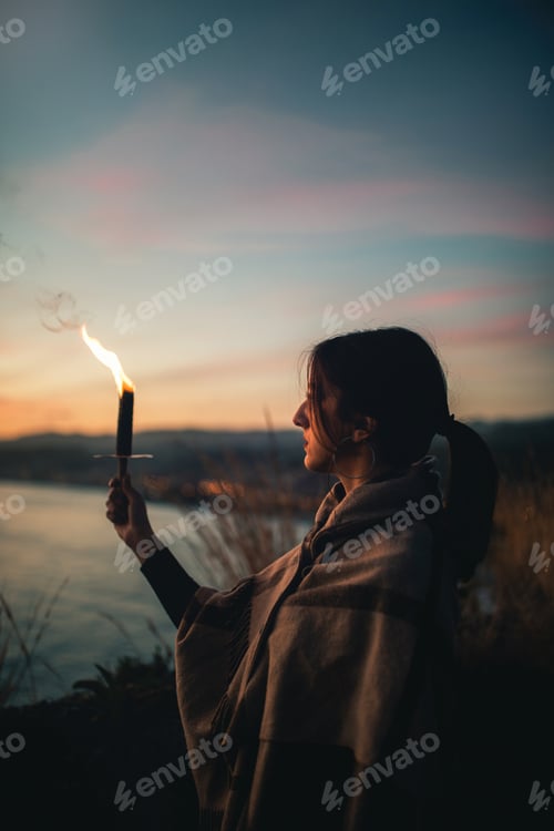 Preview: Young girl holds one in hand and looks at the horizon