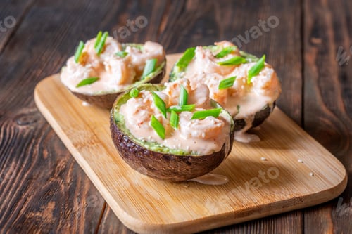 Preview: Avocado halves filled with guacamole and shrimp topped with spicy sriracha mayo