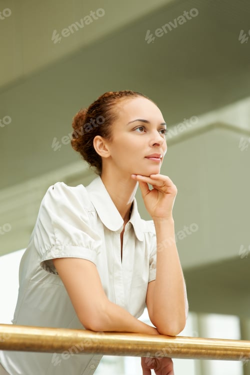 Preview: Ambitious businesswoman looking away in thought