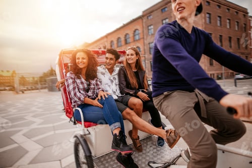 Preview: Group of teenagers traveling on tricycle