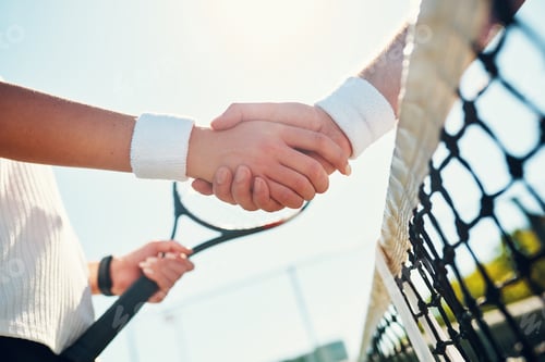 Preview: Cropped shot of two unrecognizable tennis players shaking together outdoors on the court