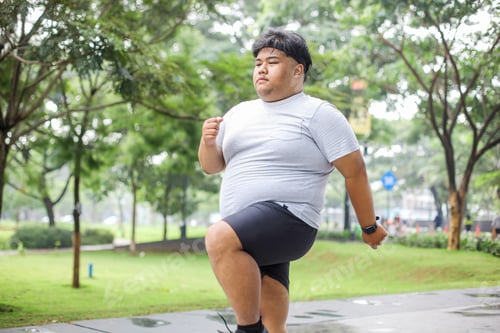 Preview: Fat Man in Sportswear Warming Up His Body Before Jogging