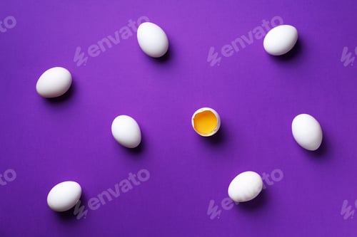 Preview: Food concept with white chicken eggs on violet background. Top view. Creative pattern in minimal