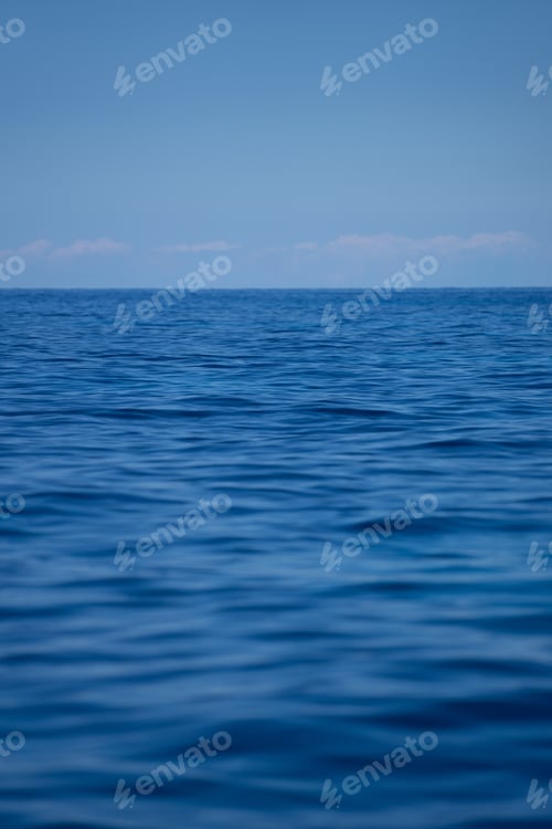 Preview: Waves of the ocean under a clear blue sky
