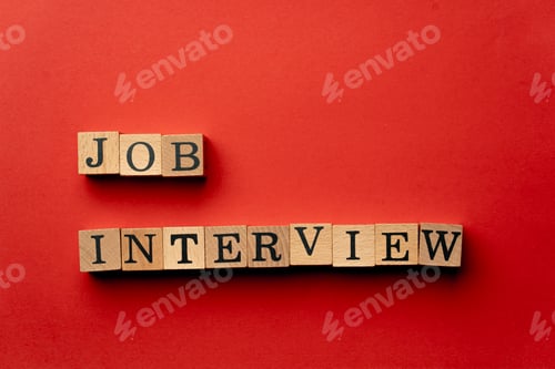Preview: a yellow warm background without shadows wooden cubes with black letters laid out word job interview