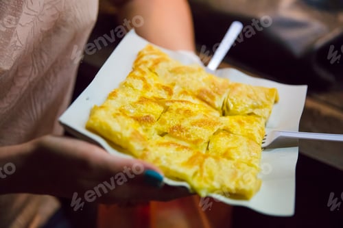 Preview: Woman Holding Plate Of Pancake At Food Stall