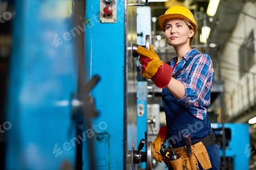 Preview: Young Machine Operator Concentrated on Work