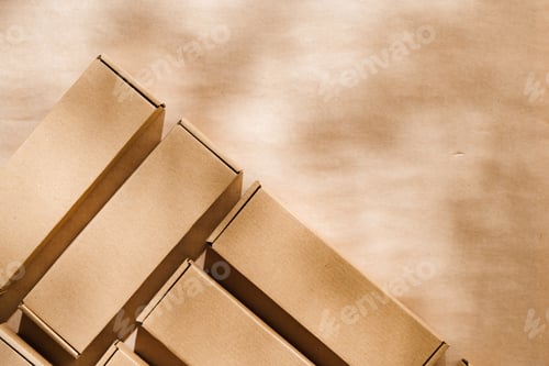 Preview: Brown cardboard boxes arranged on a neutral background in a warehouse setting during daylight hours