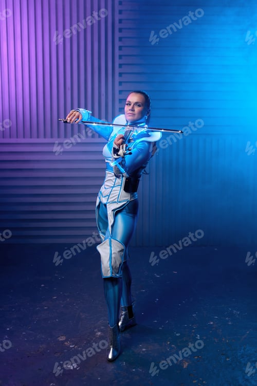 Preview: Portrait of violin solo player on stage in neon light