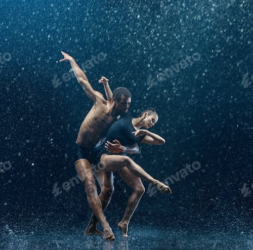 Preview: Young couple of ballet dancers dancing unde rwater drops