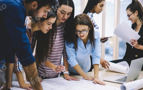 Preview: Group of coworkers discussing blueprint in office