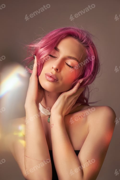 Preview: Art beauty portrait of a woman with pink hair, creative coloring. Bright colored highlights and