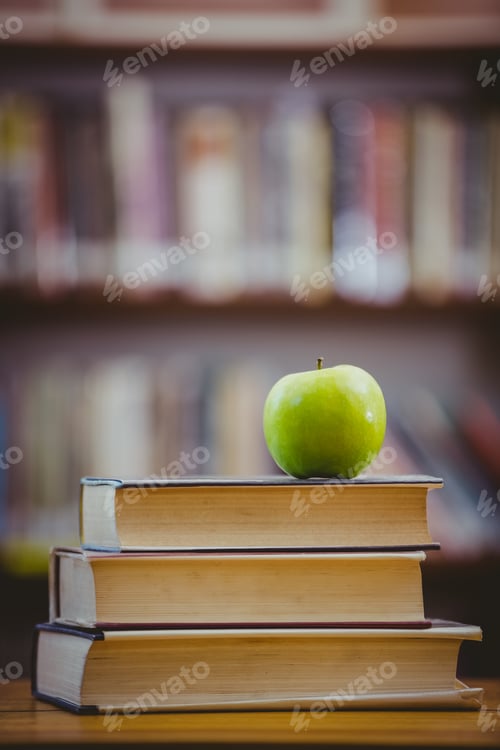 Preview: Apple on pile of books at the elementary school