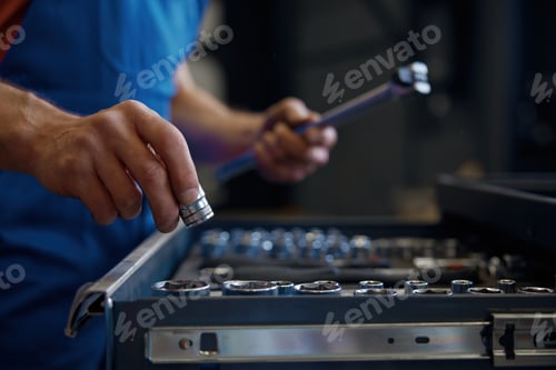 Preview: Tool box and male mechanic hands taking wrench for work