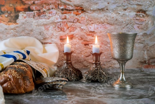 Preview: Sabbath Jewish Holiday homemade sesame challah bread and candelas on table