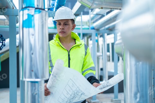 Preview: Engineer reads asbuil drawings to inspect chiller water pipes