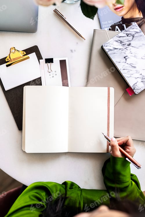 Preview: Woman writing in a journal