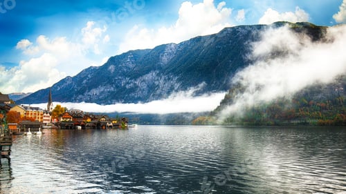 Preview: view of famous Hallstatt lakeside town reflecting in Hallstattersee lake in the Austrian Alps