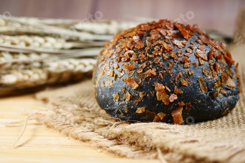 Preview: black color coconut bread on table