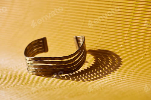 Preview: beautiful luxury bracelet on yellow striped surface