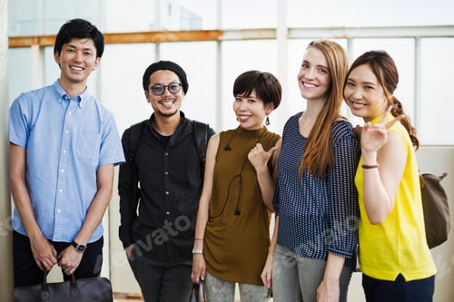 Preview: Small group of people standing on the platform of a subway station, Tokyo commuters.