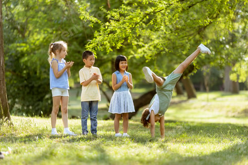Preview: Group of asian and caucasian kids having fun in the park